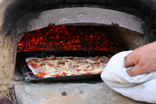 Pizza in Holzofen